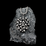 The Memento Mori Skull Cluster Pendant - Stacked Skull Medallion