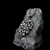 The Memento Mori Skull Cluster Pendant - Stacked Skull Medallion