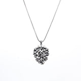 The Memento Mori Skull Cluster Pendant - Stacked Skull Medallion